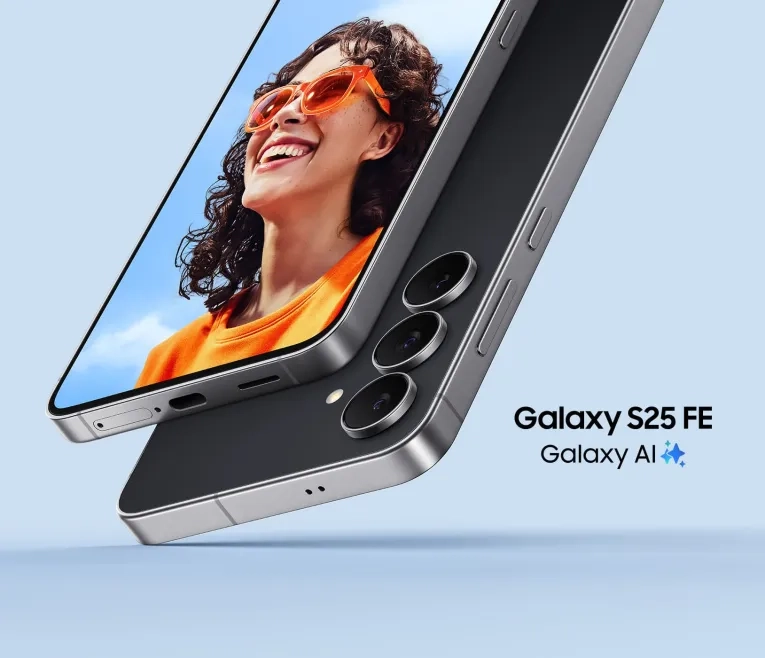 Person in orange sunglasses smiling beside a Samsung Galaxy S25 FE phone