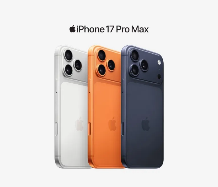 Three iPhone 17 Pro Max phones in white, orange, and navy showing rear cameras